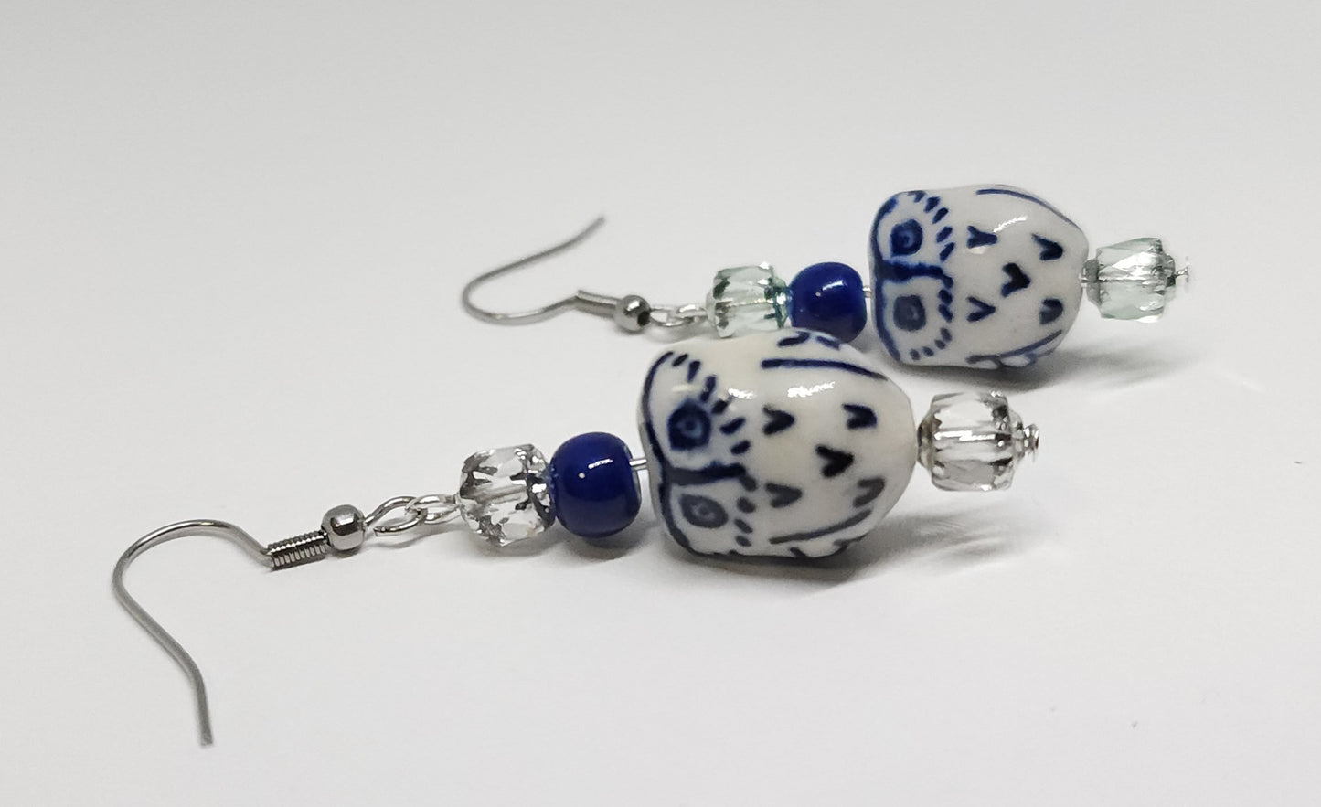 Ceramic owls with stainless steel hooks