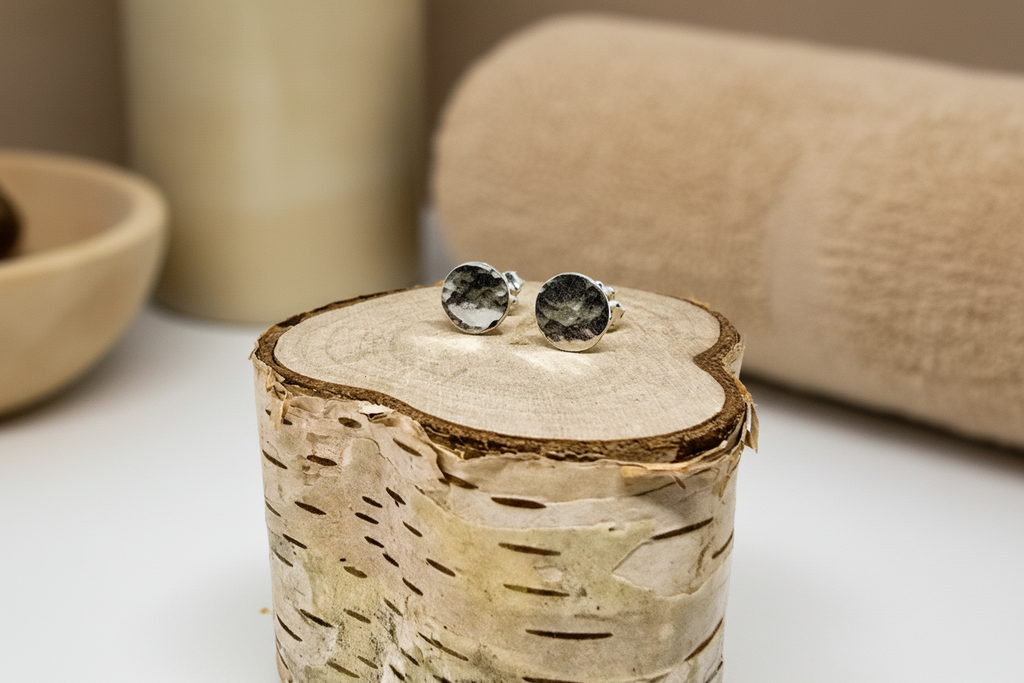 Close-up of Eclipse Radiance Studs by Jewellery by JN, highlighting hammered texture and silver shine.