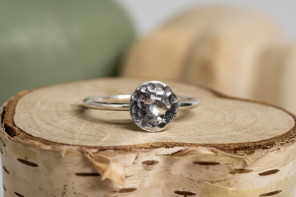 Close-up of Eclipse Ring Size Inclusive by Jewellery by JN, highlighting hammered sterling silver texture and disc.