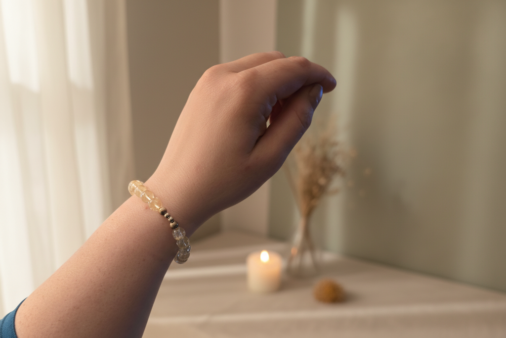 Hand holding a hair accessory with a background of jewelry displays