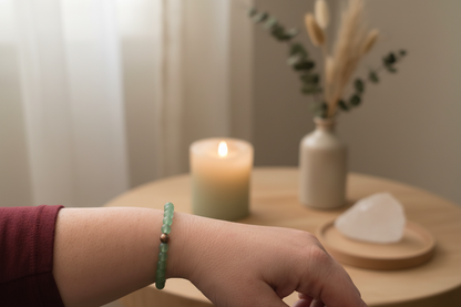 Woman’s wrist wearing the Verdant Mercy Bracelet by Jewellery by JN, with matte aventurine and a silver accent bead.