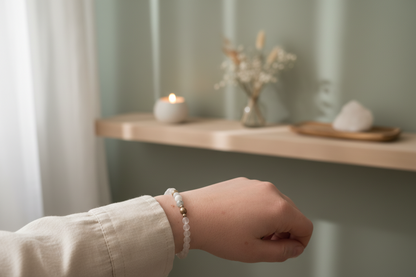 Woman’s wrist wearing the Cloudmind Bracelet by Jewellery by JN, with matte crystal quartz, amazonite, and silver accent beads.