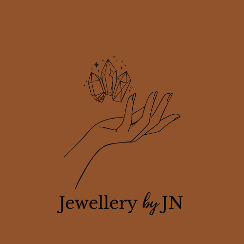 Illustration of a hand holding crystals with 'Jewellery by JN' text on a brown background