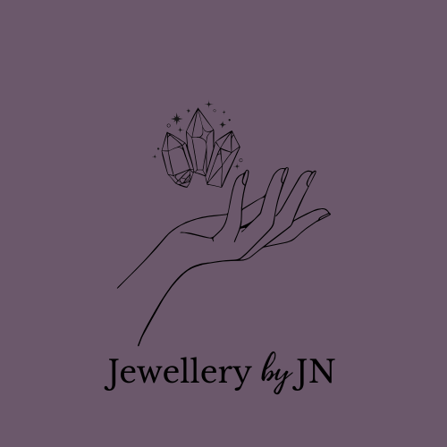 Logo of 'Jewellery by JN' featuring a hand holding crystals on a beige background.