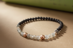Close-up of Shadowseer Bracelet by Jewellery by JN, highlighting the labradorite, volcanic rock, and sterling silver bead details