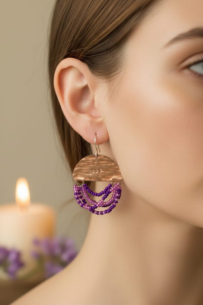 Woman wearing Mini Wordkeeper Earrings Got This by Jewellery by JN, showing copper, purple, pink, and silver bead fringe, and silver ear wires.