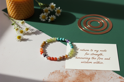 Elder Fire Bracelet by Jewellery by JN with handwritten affirmation card, styled with ritual props on a creamy background.