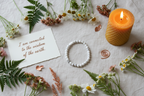 Quiet Armour Bracelet by Jewellery by JN with handwritten affirmation card, styled with ritual props on a creamy background.