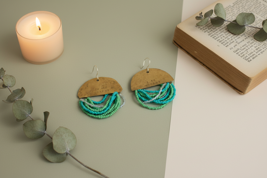 Half Moon Wordkeeper Earrings styled with ritual props, featuring brass, bead fringe, and silver, Jewellery by JN.