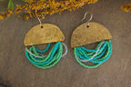 Close-up of Half Moon Wordkeeper Earrings by Jewellery by JN, highlighting hammered brass, beadwork, and hand-stamped affirmations.