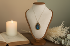 Emberheart Pendant styled with ritual props, featuring labradorite, copper, and silver, Jewellery by JN
