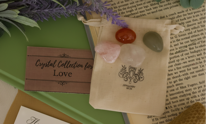 Love Gemstone Bag by Jewellery by JN, recycled cotton pouch with tumbled Carnelian, Rose Quartz, Clear Quartz, and Green Aventurine, displayed on creamy linen with ritual props.