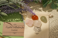Crystal collection for love on a book with lavender and green leaves
