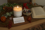 Manifestation Intention Candle by Jewellery by JN styled with journal, affirmation card, dried flowers, and ritual objects on earthy background.