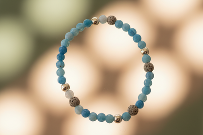 "Close-up of Shadowcurrent Bracelet by Jewellery by JN, highlighting the blue agate, volcanic rock, and sterling silver bead details."