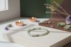 Grave Earth Bracelet styled with ritual props, featuring amazonite and a silver bead, Jewellery by JN.
