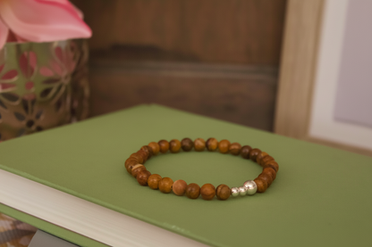 Close-up of Emberroot Bracelet by Jewellery by JN, highlighting the Iron Zebra Jasper and sterling silver bead details.