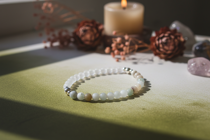 Cloudmind Bracelet styled with ritual props, featuring matte crystal quartz, amazonite, and silver beads, Jewellery by JN.