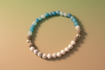 Close-up of Truthweaver Bracelet by Jewellery by JN, highlighting the blue agate, howlite, volcanic rock, and sterling silver bead details."
