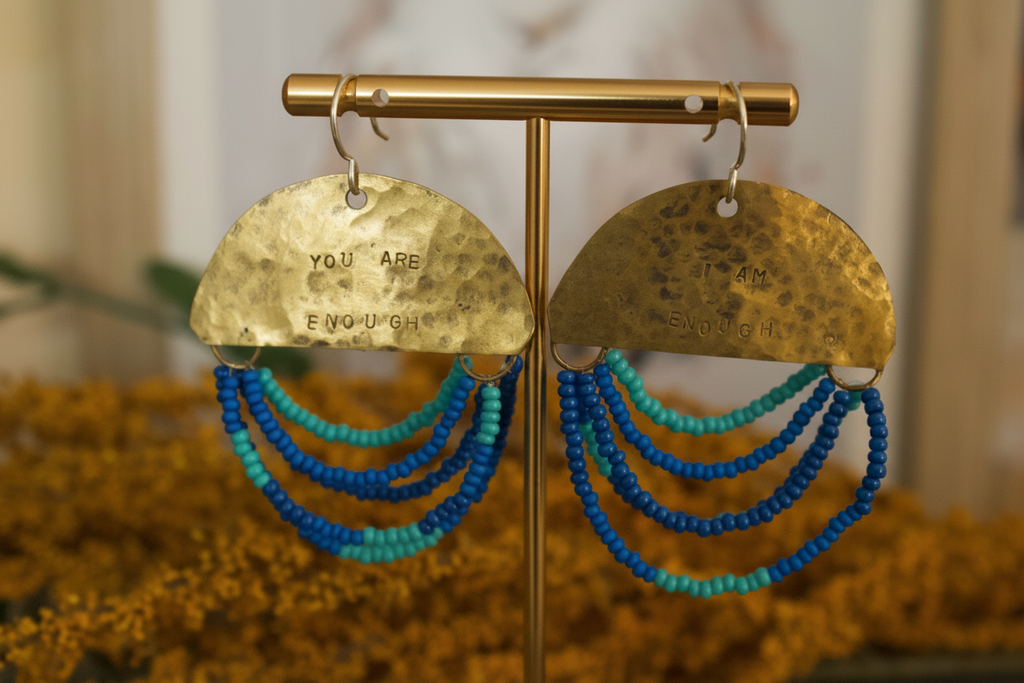 Close-up of Half Moon Wordkeeper Earrings Loved by Jewellery by JN, highlighting hammered brass, beadwork, and hand-stamped affirmations.
